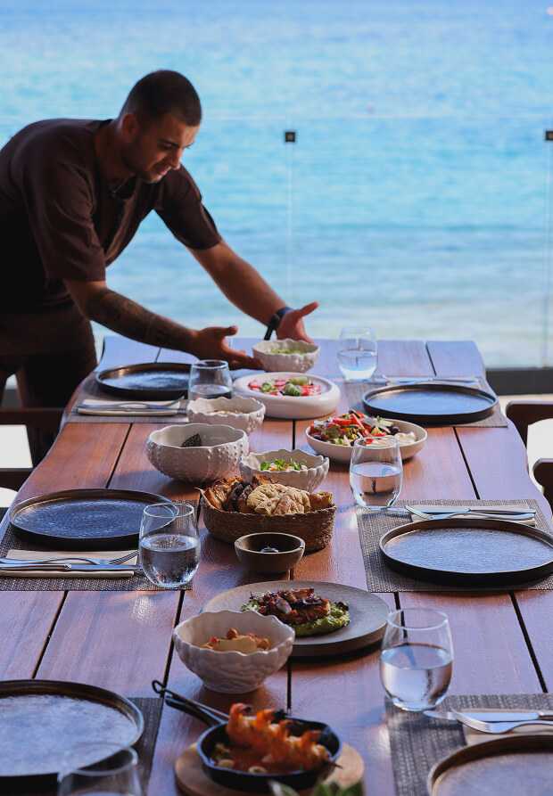 Setting up the table at Baladaya restaurant