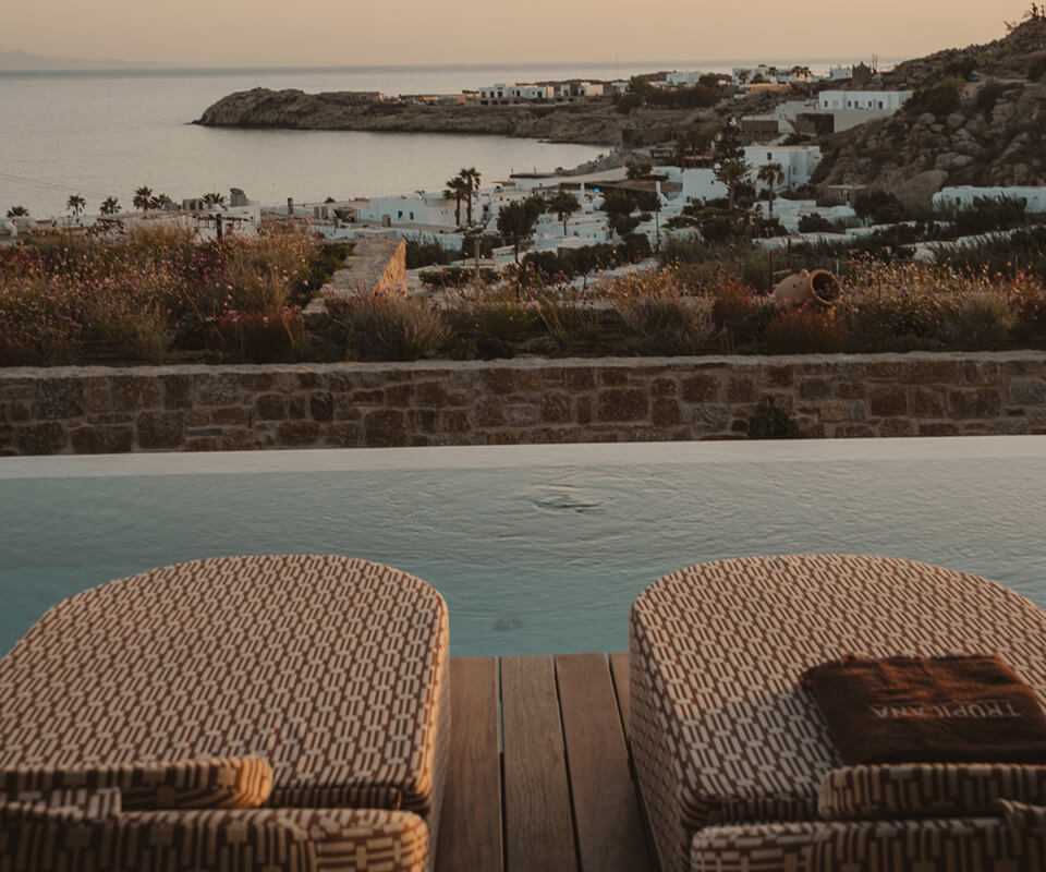 Poolside sunbeds with a sea view